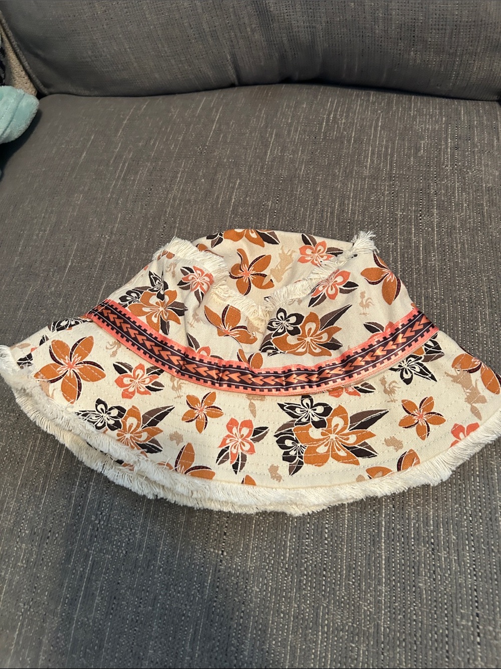 Disney Floral Fringed Bucket Hat in Cream, Orange, Black